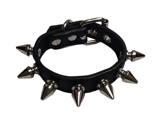 Black faux leather cuff bracelet with single row of spikes top view