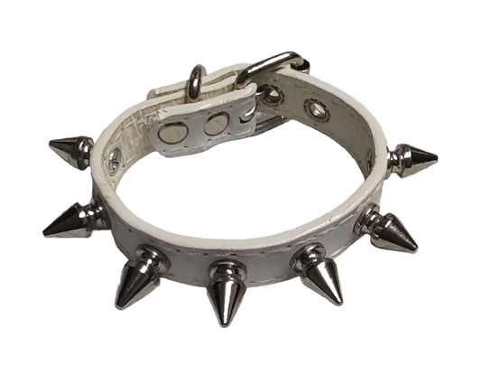 White faux leather cuff with single row of spike top view