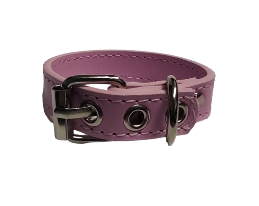 Pink faux leather cuff bracelet with buckle and eyelets back view