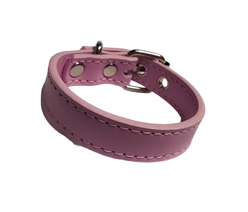 Pink faux leather cuff bracelet with buckle and eyelets front view