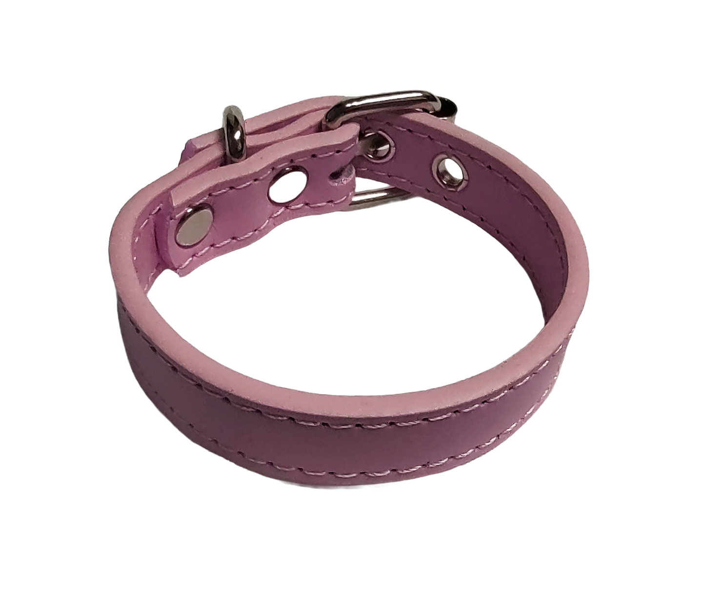 Pink faux leather cuff bracelet with buckle and eyelets top view