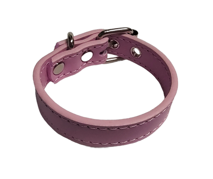 Pink faux leather cuff bracelet with buckle and eyelets top view