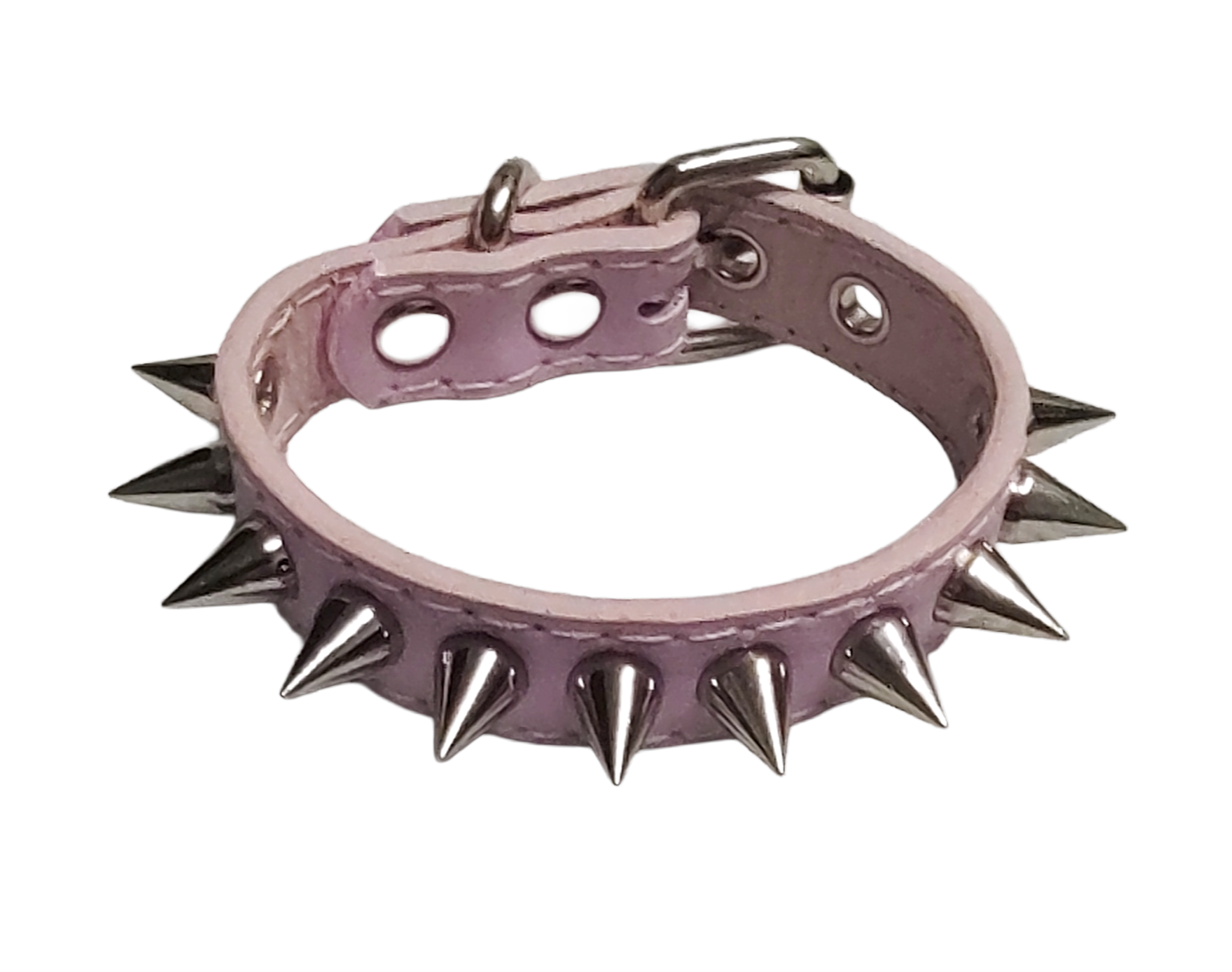 Light pink faux leather cuff bracelet with single row of cone spikes top view