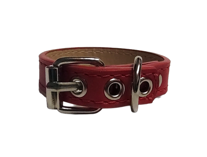 Red faux leather cuff bracelet with buckle and eyelets back view
