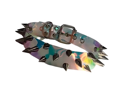 Clear plastic holographic iridescent choker collar with three rows of spikes front view