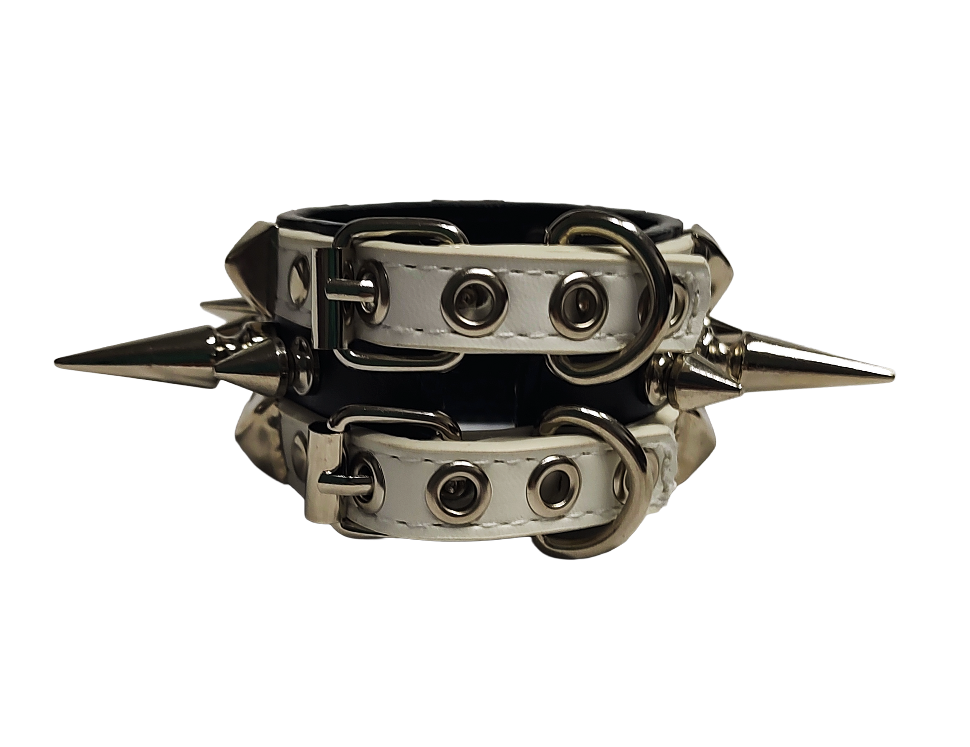 White and black faux leather cuff with alternating spikes and pyramid studs back view