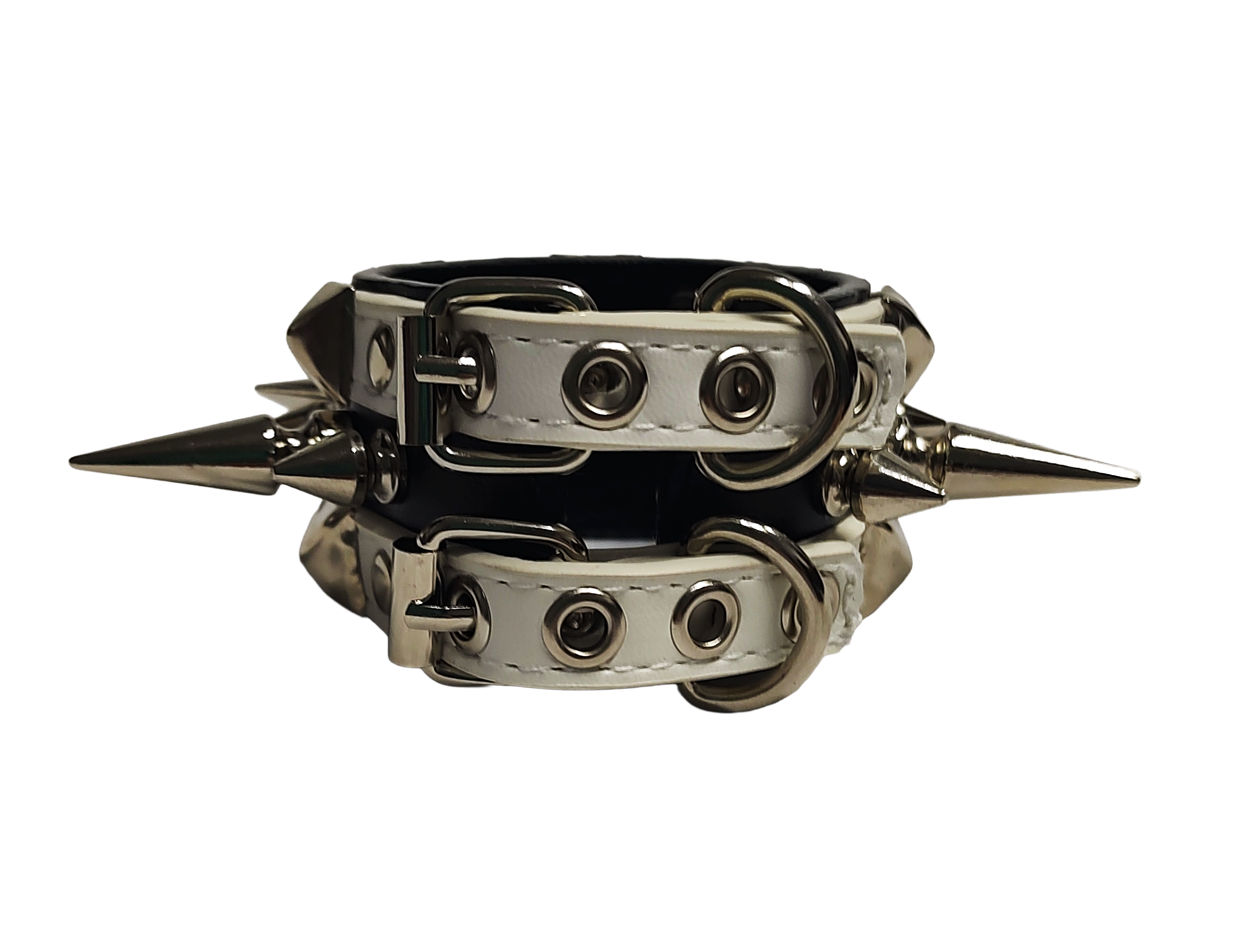 White and black faux leather cuff with alternating spikes and pyramid studs back view