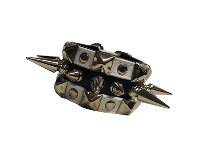 White and black faux leather cuff with alternating spikes and pyramid studs front flat view