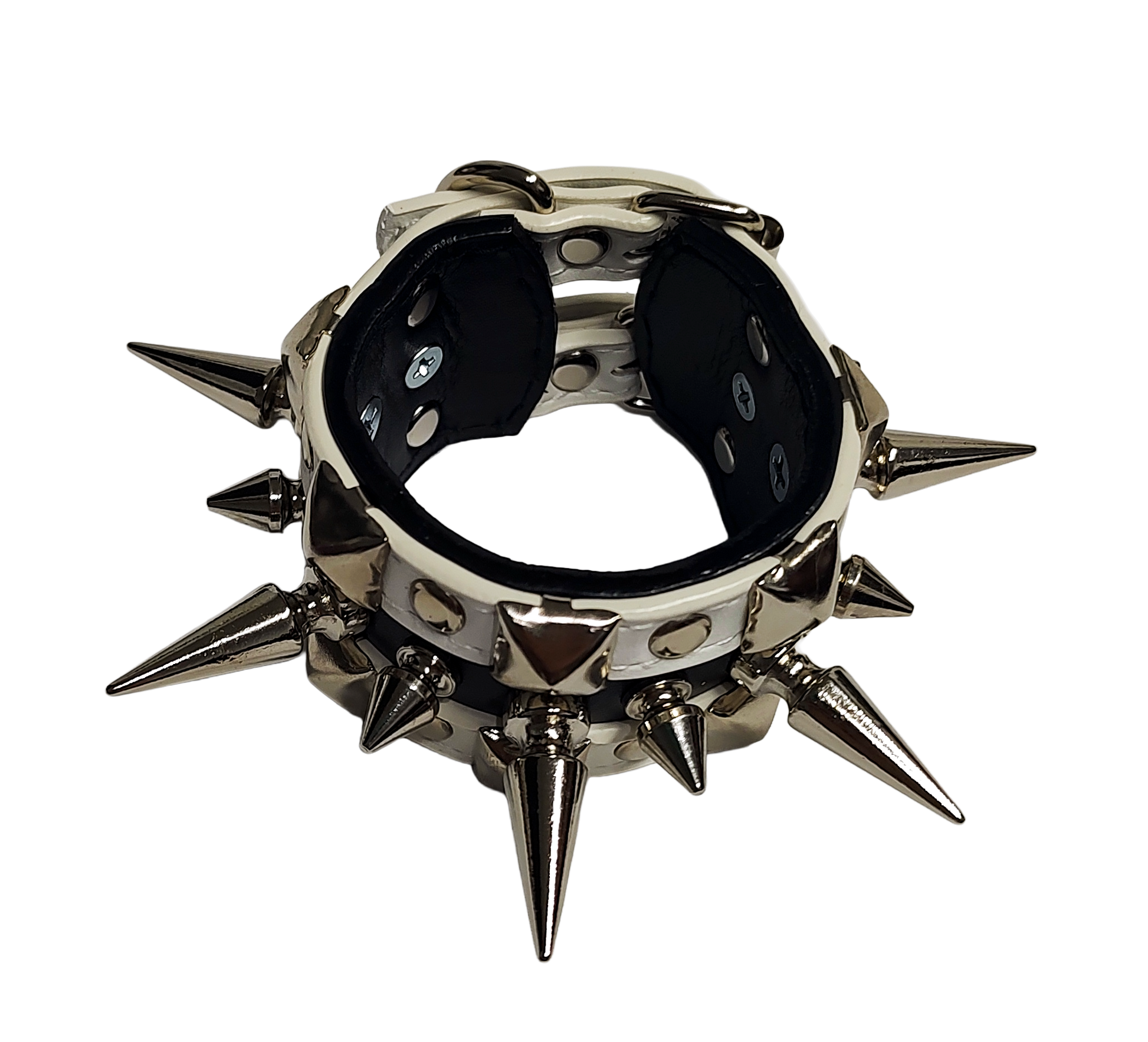 White and black faux leather cuff with alternating spikes and pyramid studs top front view