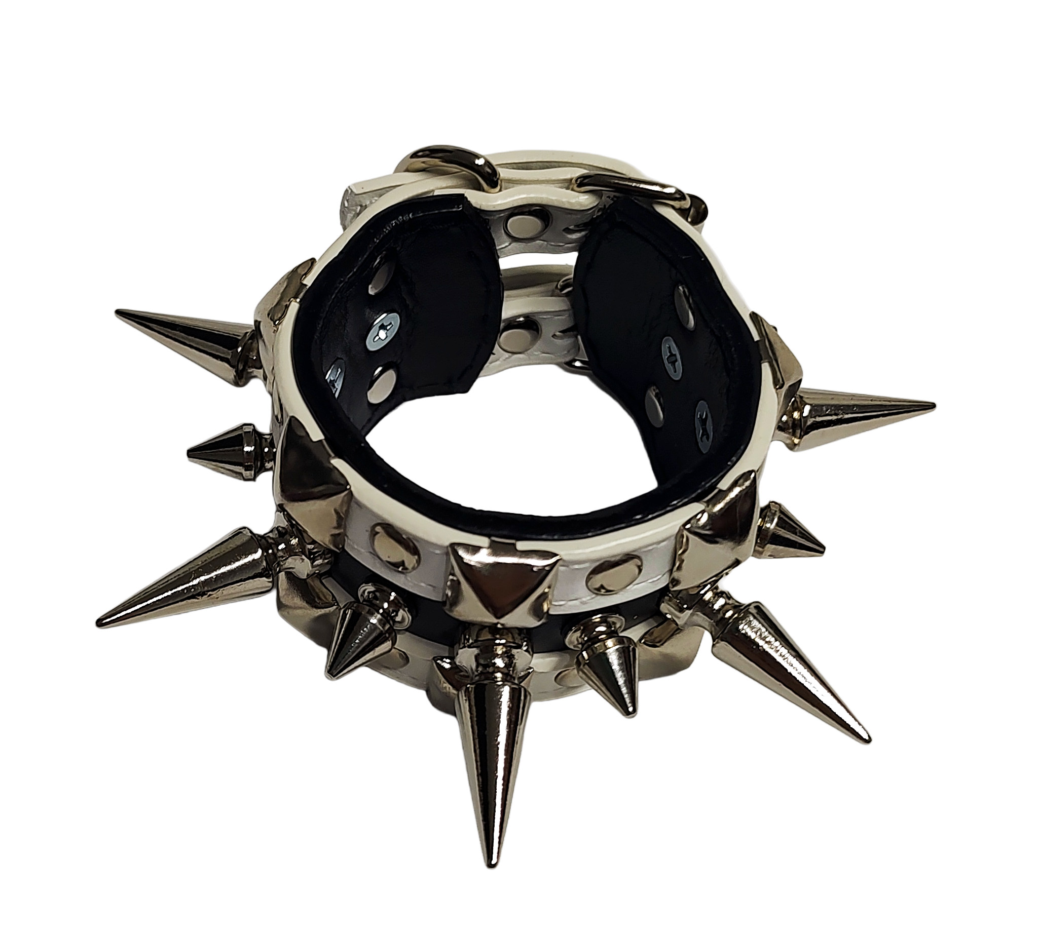 White and black faux leather cuff with alternating spikes and pyramid studs top front view