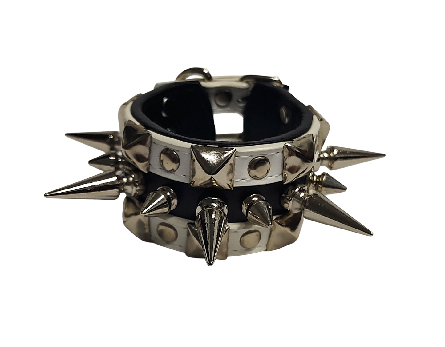 White and black faux leather cuff with alternating spikes and pyramid studs front view