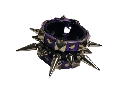 Purple and black faux leather cuff bracelet with alternating tree spikes rivets and pyramid studs front view