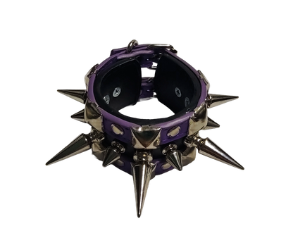 Purple and black faux leather cuff bracelet with alternating tree spikes rivets and pyramid studs top front view