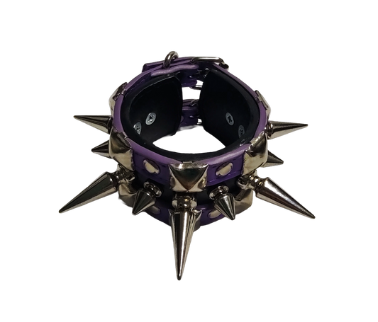Purple and black faux leather cuff bracelet with alternating tree spikes rivets and pyramid studs top front view