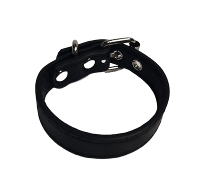 Black faux leather cuff bracelet with buckle and eyelets top view