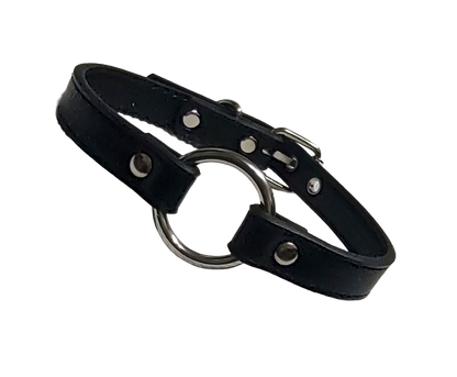 Black faux leather collar with metal ring on a white background