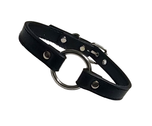 Black faux leather collar with metal ring on a white background