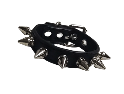 Black faux leather cuff bracelet with single row of spikes front view