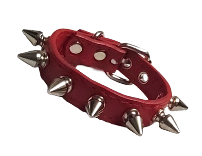 Red faux leather cuff with single row of spikes front view