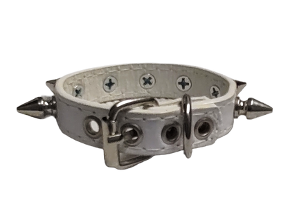 White faux leather cuff with single row of spikes back view
