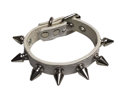 White faux leather cuff with single row of spike top view