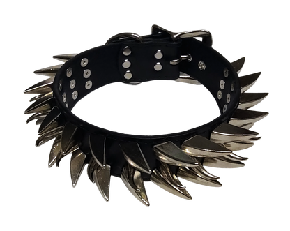 Black faux leather collar with two outer rows of dragon claw spikes and center row of cat claw spikes top view