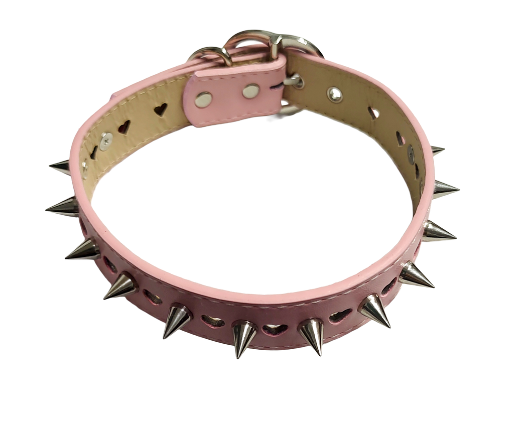 Pastel pink faux leather heart cut out collar with cone spikes and heart buckle top view